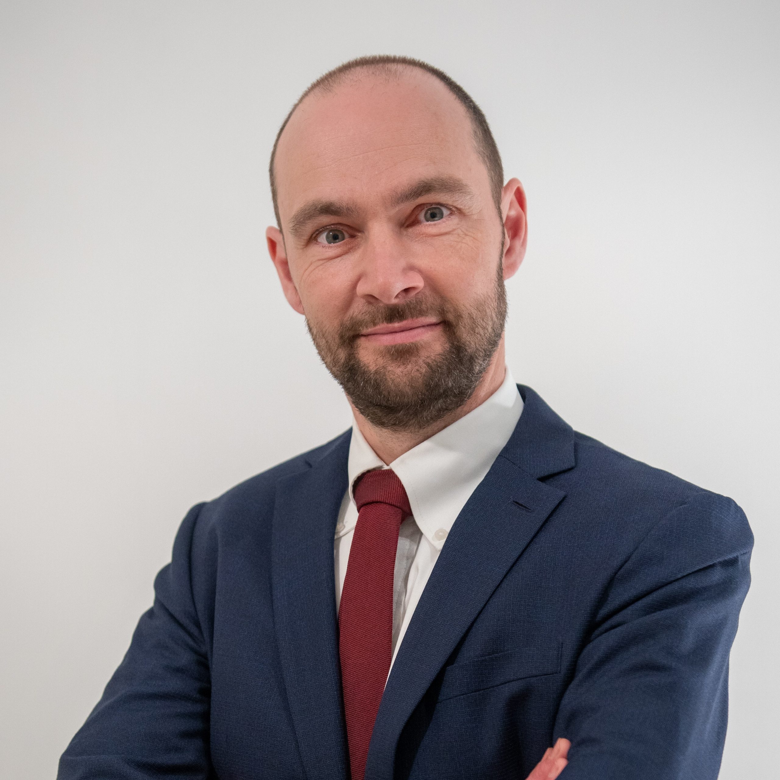 A photo of our CEO Ywein on a white background. He is wearing a suit.